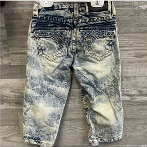 Robyn Blue Distressed Jeans with boring on back sz 2